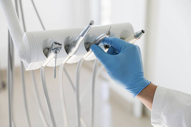 Professional Tooth Extraction technician working in Memphis, MI